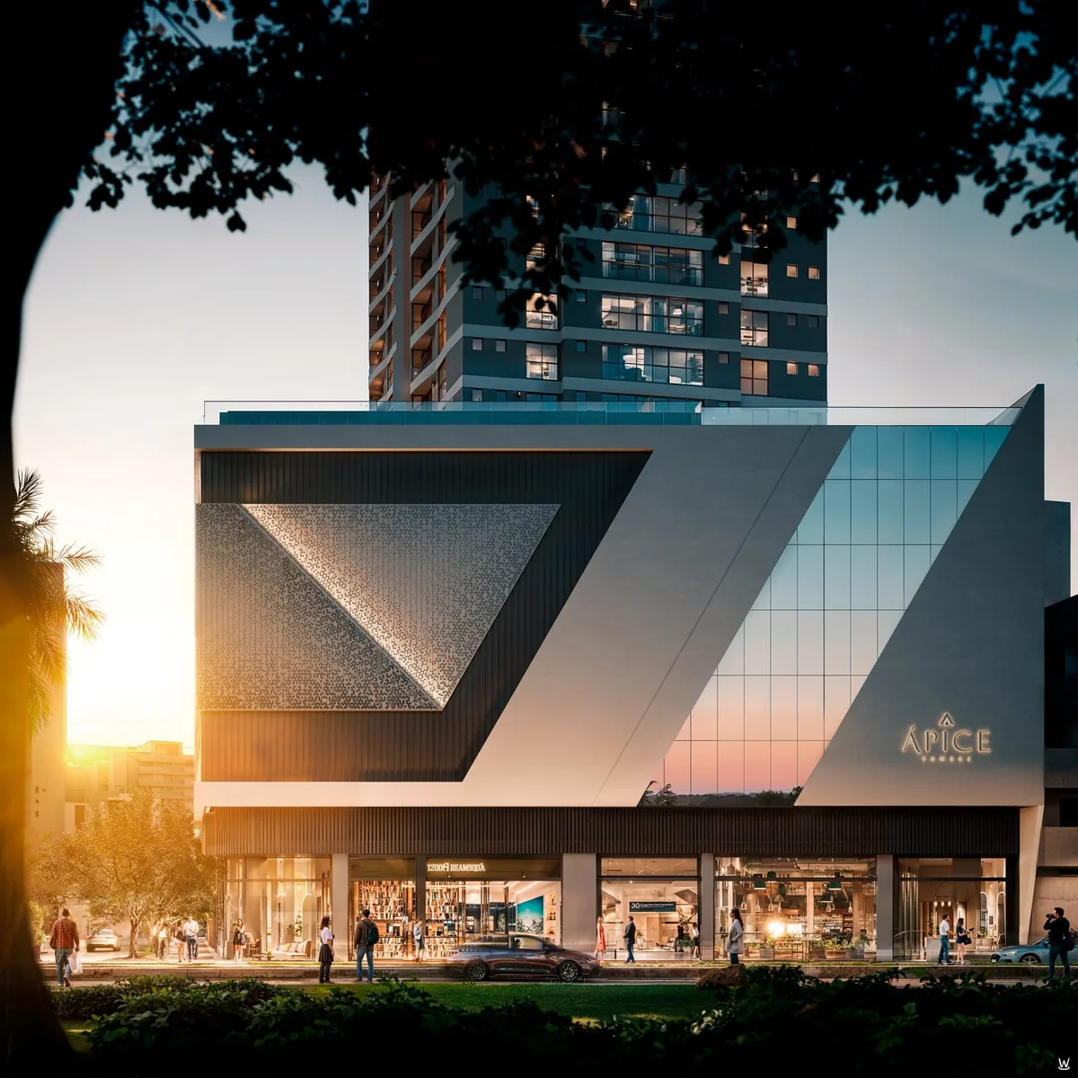 As salas comerciais do térreo ao pôr do sol, com vitrines iluminadas e pessoas passando no calçadão