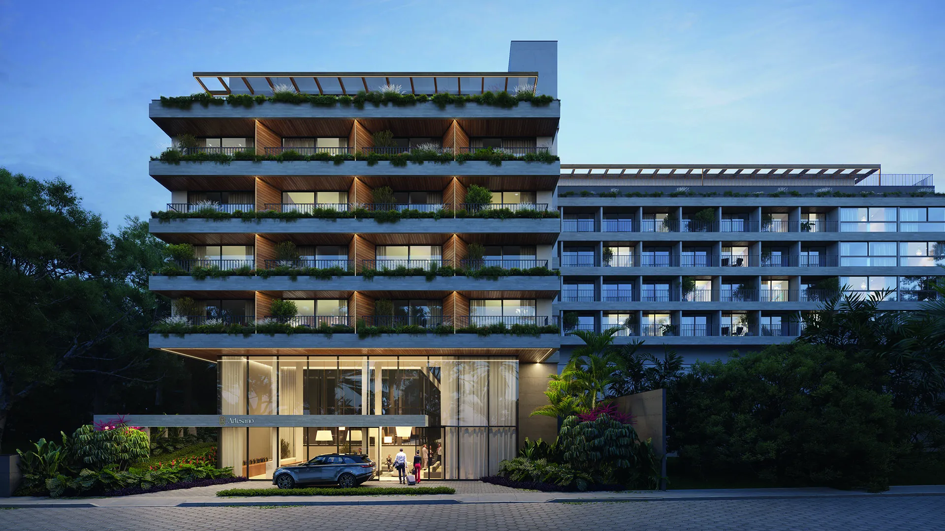 Fachada do Artesano by Hilton ao entardecer, com varandas ajardinadas em todos os pavimentos