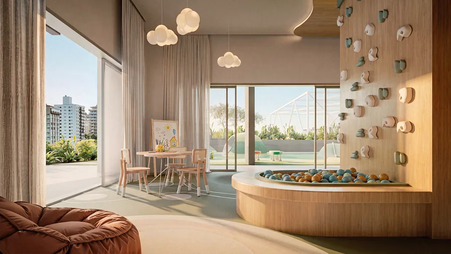 Espaço infantil coberto, com parede de escalada, piscina de bolinhas embutida em marcenaria curva e mesa baixa