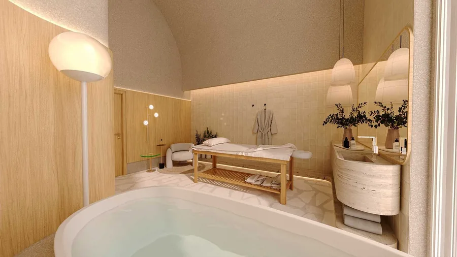 Sala de massagem com banheira, maca e marcenaria clara