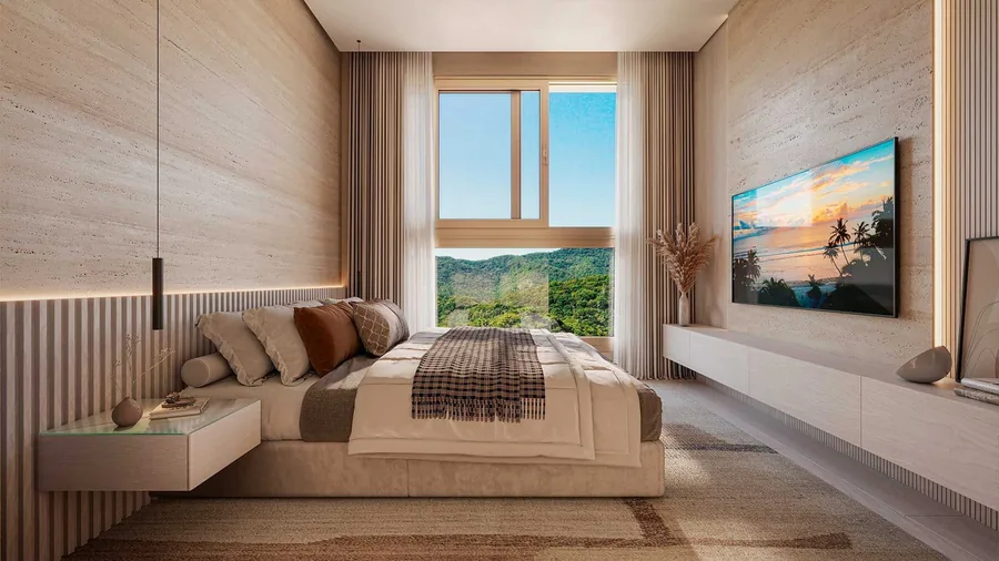 Suíte com cama de casal, marcenaria clara e janela para a mata