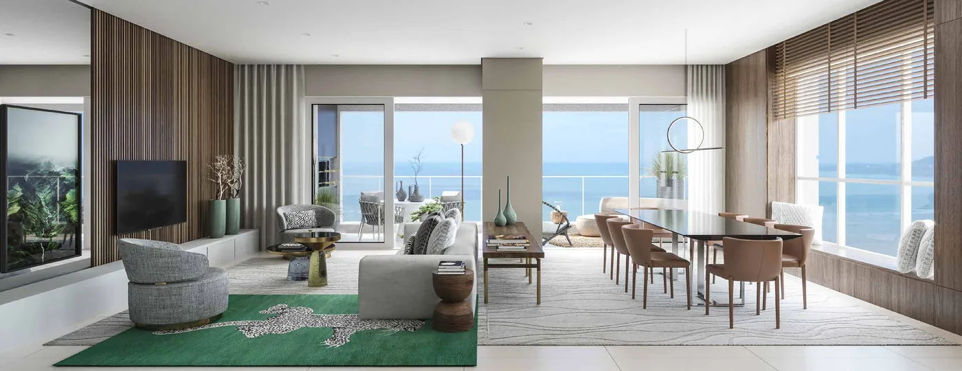 Living do apartamento tipo, com sala de jantar e estar integradas e uma parede de vidro aberta para o mar