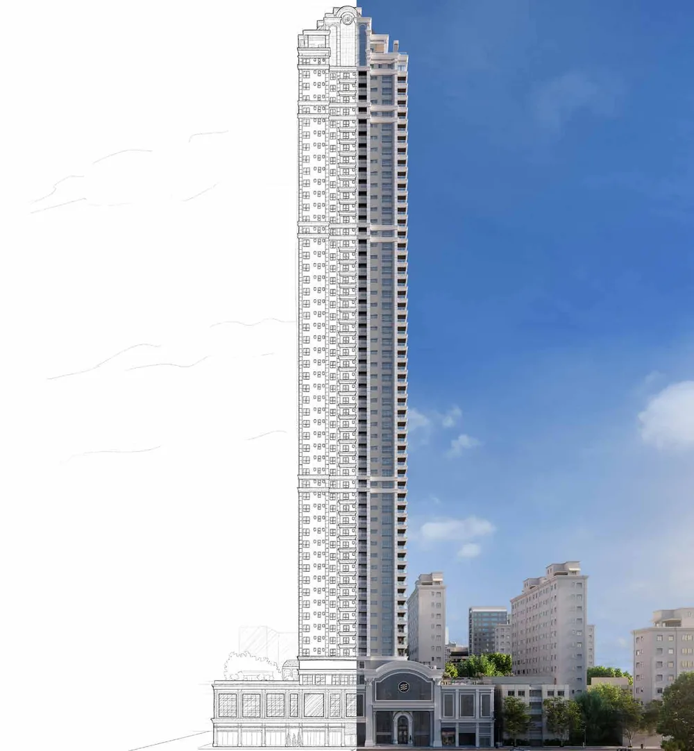 A torre do L'Atelier vista de baixo, esguia contra o céu, com fachada clássica branca e coroamento em cúpula