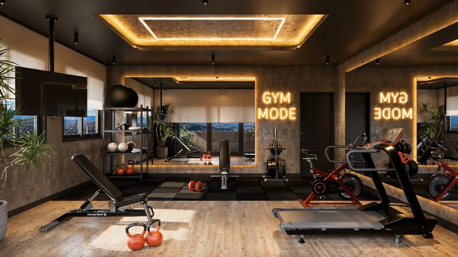 Fitness com esteira, bicicleta, banco de supino e pesos, diante de janela com vista para a mata