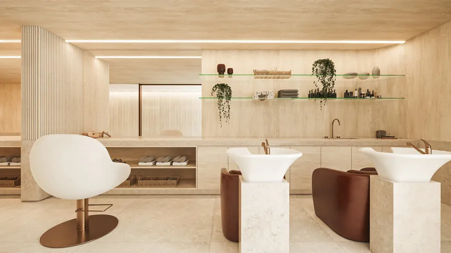 Espaço beauty com duas cubas esculpidas, cadeiras curvas e prateleiras claras