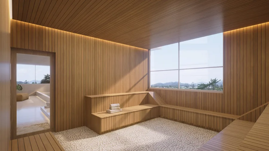 Sauna revestida em madeira clara, com banco corrido e janela ampla