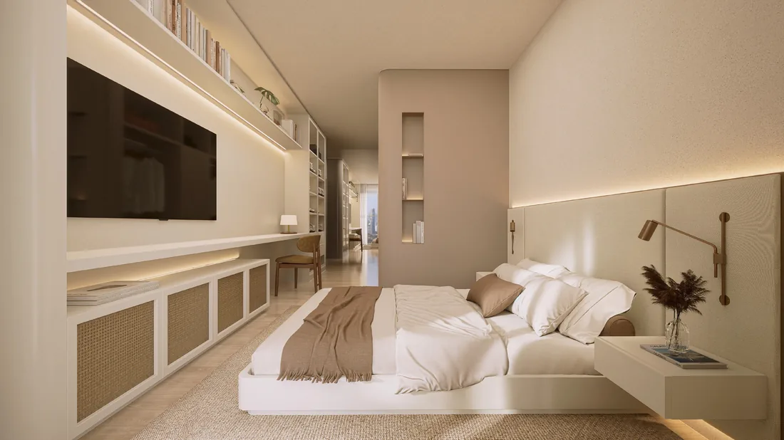 Suíte do apartamento com cama de casal, painel de madeira e marcenaria embutida