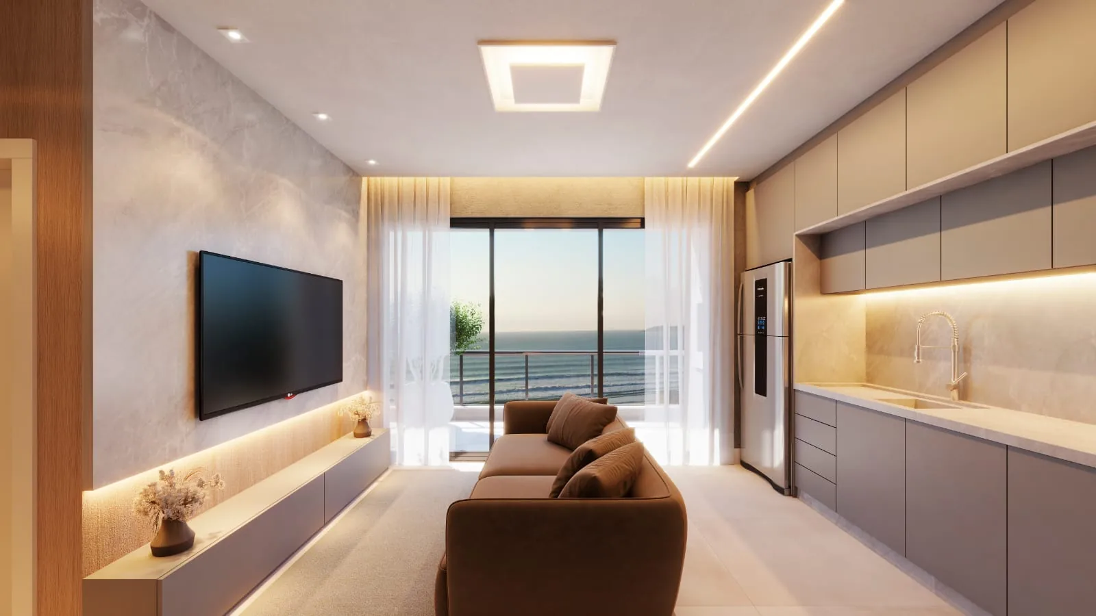 Living da cobertura, com painel de televisão sobre o rack claro, sofá marrom, cozinha ao fundo e a cortina filtrando a luz do mar
