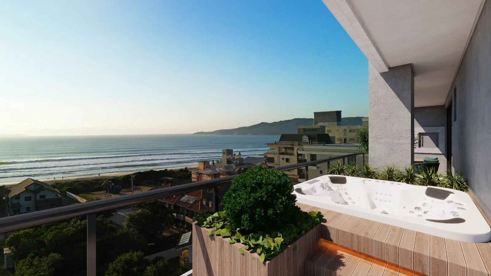 Terraço da cobertura com deck de madeira, spa embutido, jardineira na borda e a vista aberta para a praia de Canto Grande