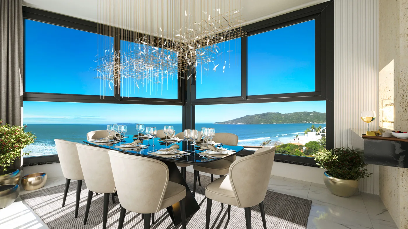 Varanda com churrasqueira do apartamento tipo, com mesa posta para seis e janelas abertas para o mar