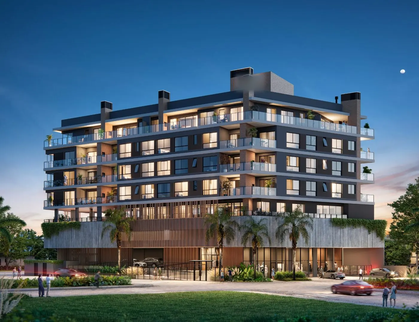 Edifício residencial iluminado ao anoitecer, com varandas amplas e jardins